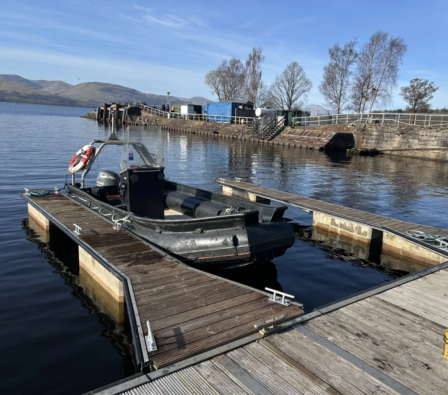 RIB alongside floating pontoons