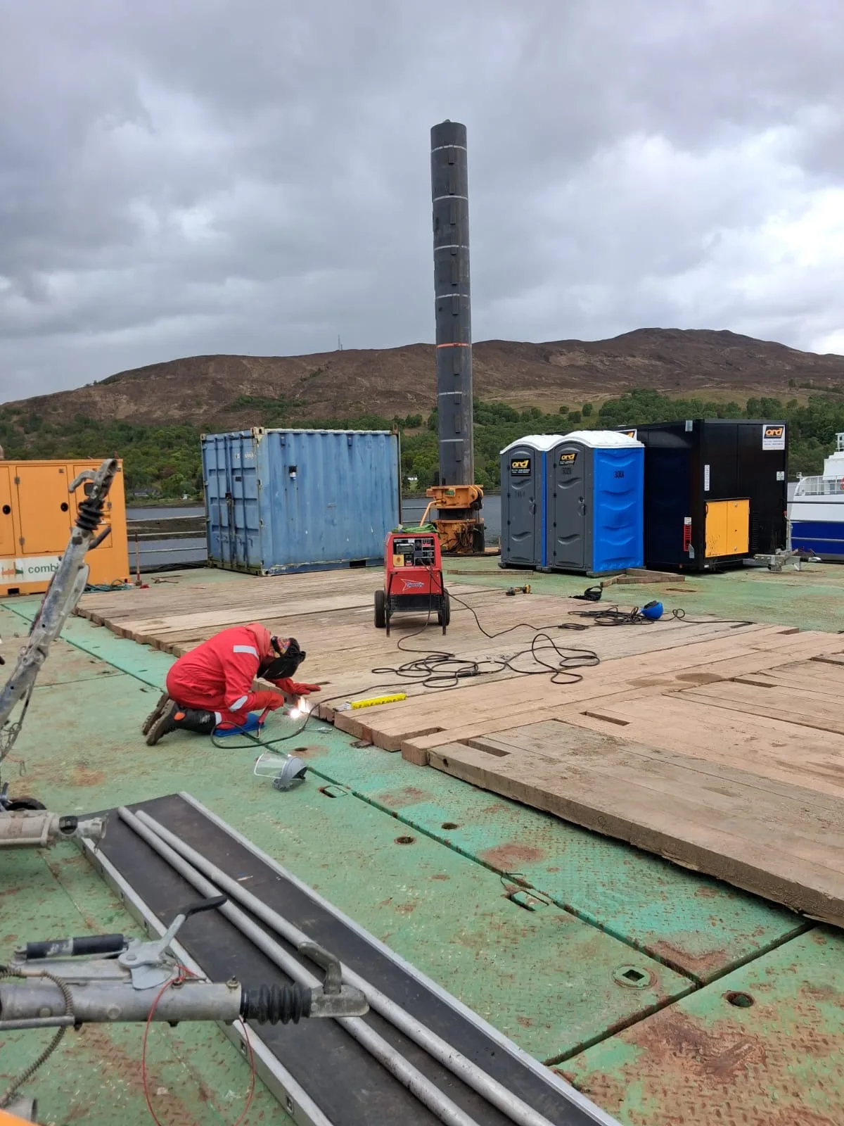 Welder working on decking on a jack-up platform